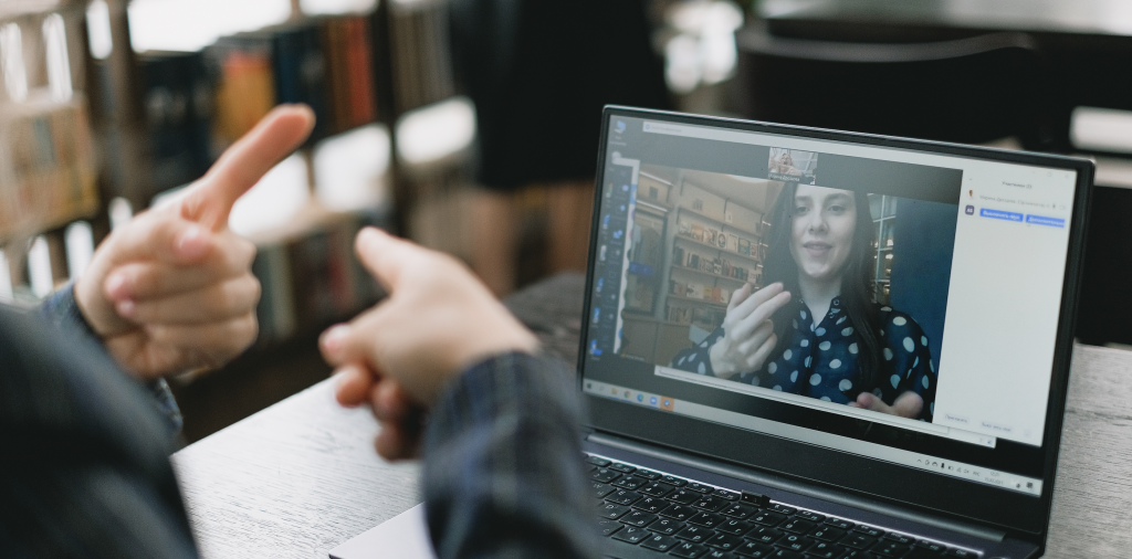 Two people have an ASL American Sign Language conversation over video call after learn ASL online with Sign Language Blitz